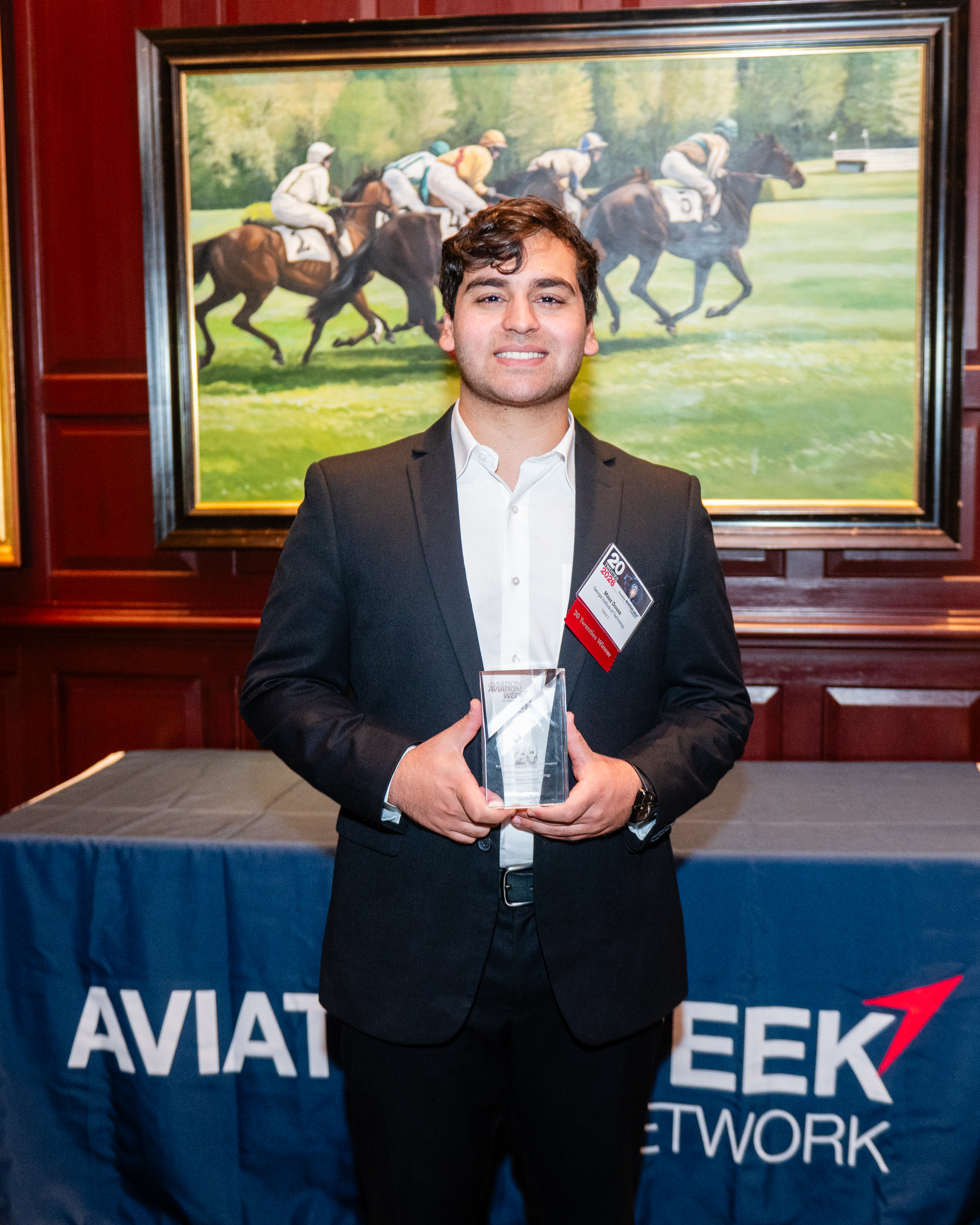 Maaz Dossa accepting the Aviation Week 20 Twenties award